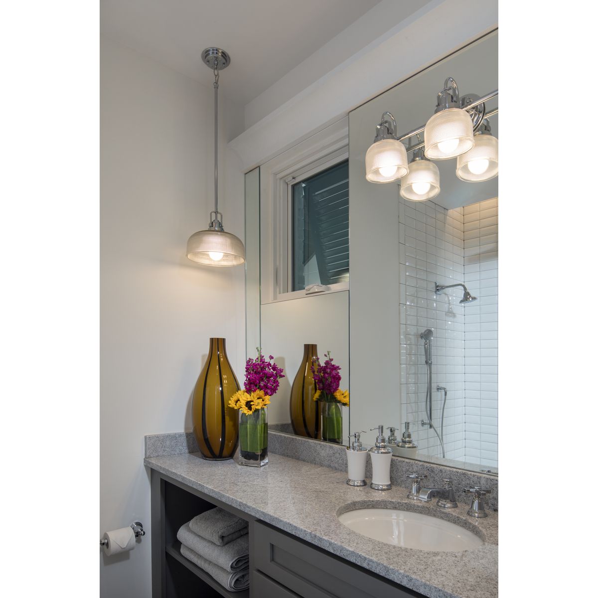 Progress Lighting Archie polished chrome bath vanity wall light in bathroom setting