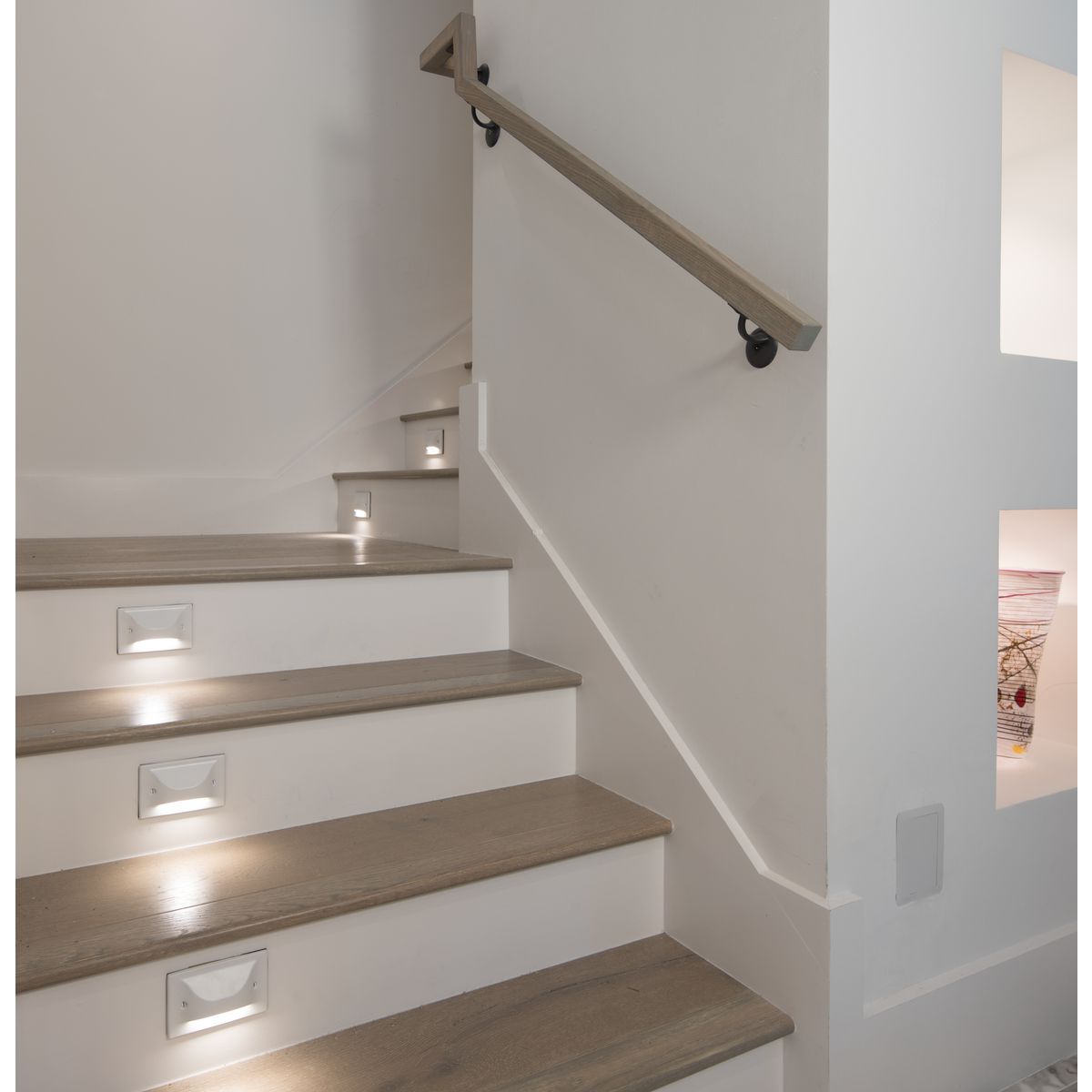 Progress Lighting P660005-028-30 LED Hood Step Light installed on stairway in Satin White