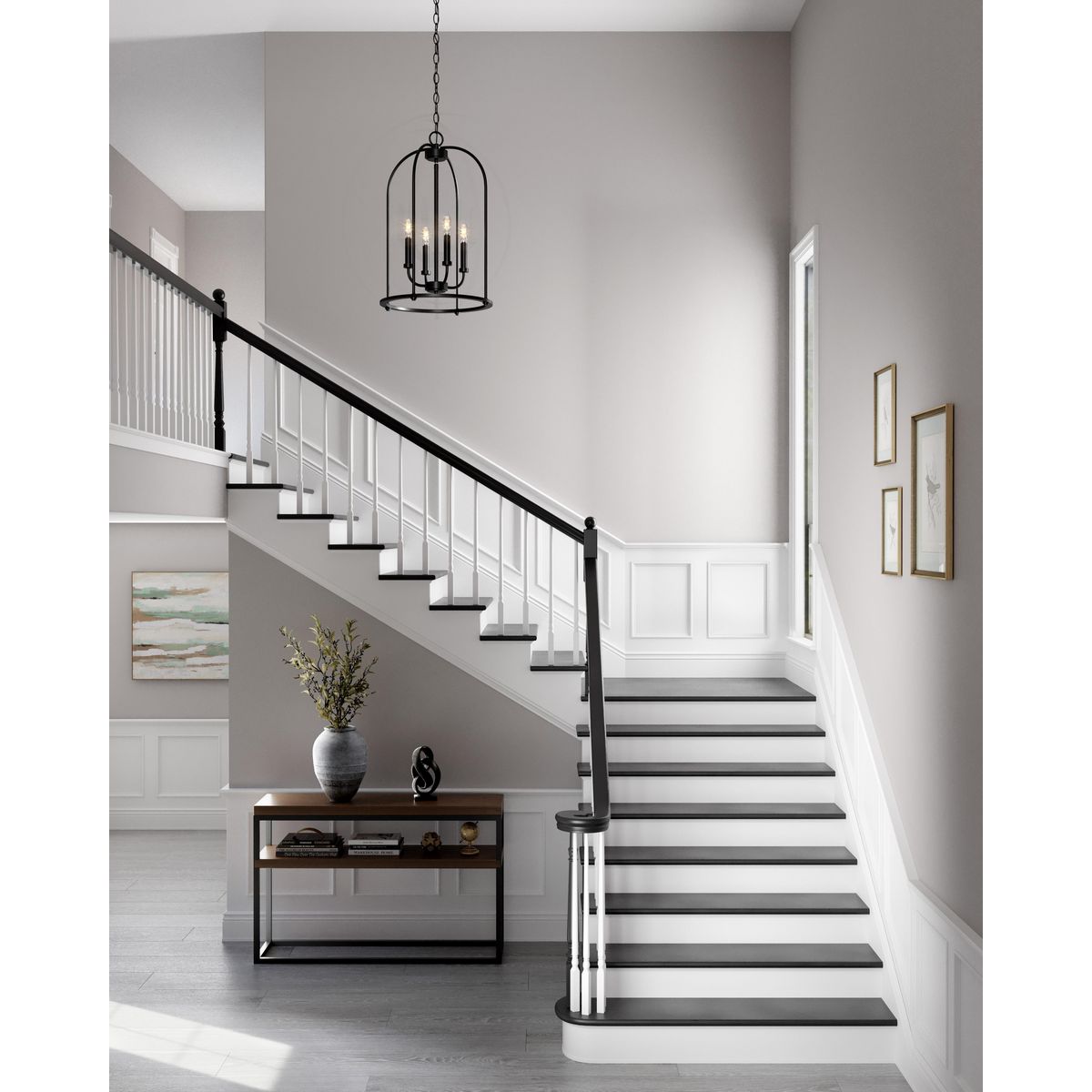 Progress Lighting Leyden matte black foyer pendant installed over staircase
