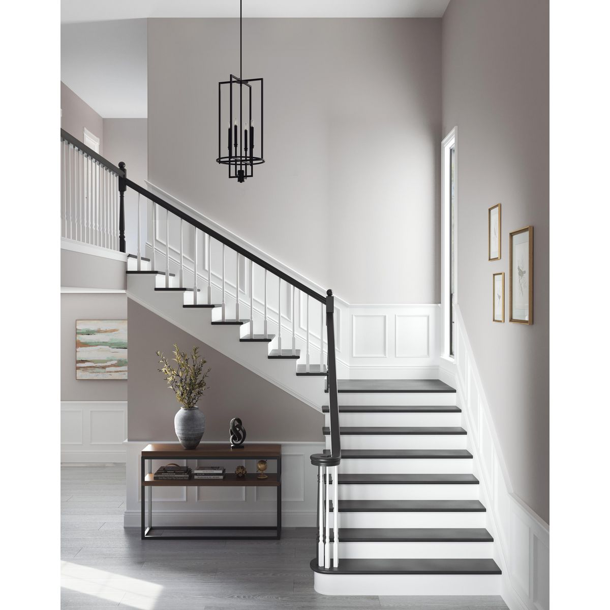 Progress Lighting Elara matte black foyer chandelier in staircase setting