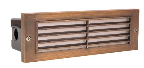 Natural brass step light with a rectangular louvered design, featuring a 20" wire lead.
