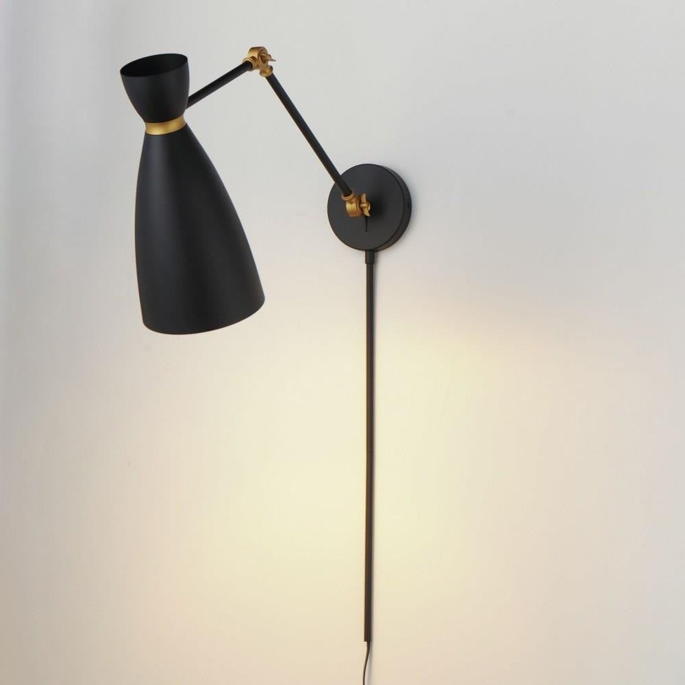 Maxim Lighting 11300WTSBR Carillon Wall Sconce illuminated showing warm light cast on wall