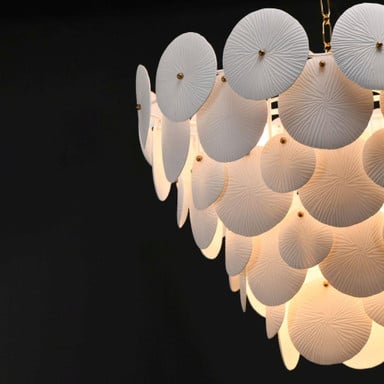 Maxim Lighting 12827WTNAB Isla Chandelier detail of textured ceramic panels and brass knobs