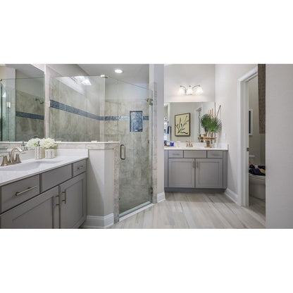 Maxim Lighting Aurora Bath Vanity Wall Light lifestyle photo installed above bathroom vanity