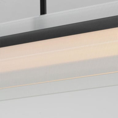 Maxim Lighting 21194CRBKNAB Spectre Linear Pendant - close-up detail of ribbed glass shade and brass pins