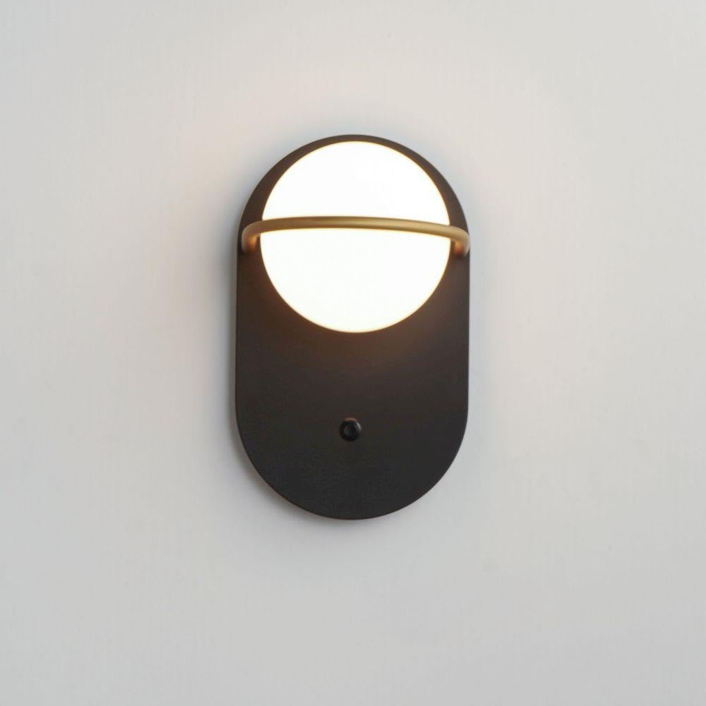 Maxim Lighting 21600SWBKGLD Revolve Wall Sconce Illuminated on Wall
