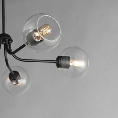 Maxim Lighting 21635CLNAB Knox Chandelier close-up detail of clear glass globes and black arms