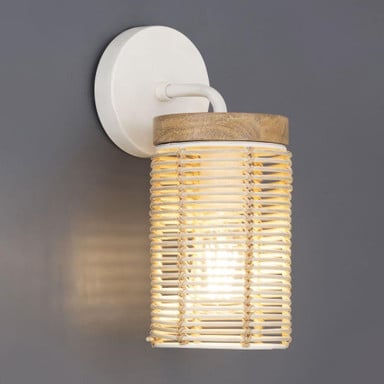 Maxim Lighting 22440NAEC Vannerie Wall Sconce lit on gray wall - angle view