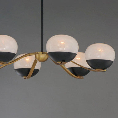 Maxim Lighting 24646MRBKNAB Lucerne Chandelier detail shot highlighting black cap finish and natural aged brass curved arms