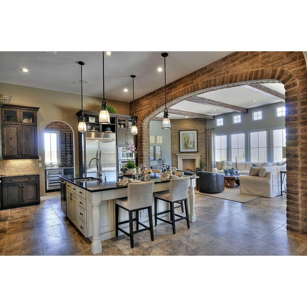 Maxim Lighting 25002CLBZ Hi Bay Mini Pendant Ceiling Light installed over kitchen island in rustic open-plan interior