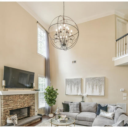 Maxim Lighting 25147ARPN Orbit 12 Light Pendant installed in a high-ceiling living room with fireplace, lifestyle photo