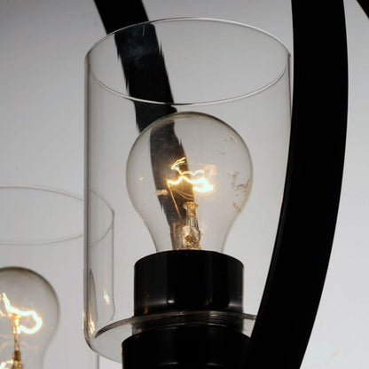Maxim Lighting 25254CLBK Sentinel Pendant close-up detail of clear glass cylindrical shade with illuminated bulb on black metal frame