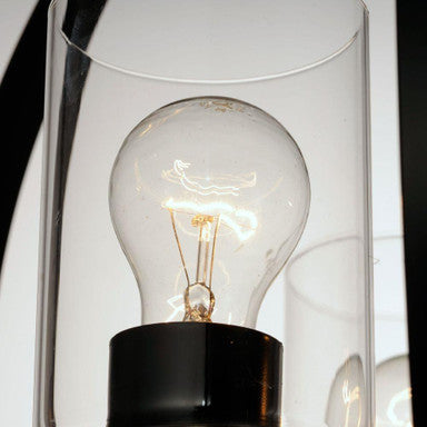 Maxim Lighting 25254CLBK Sentinel Pendant detail view of clear glass shade and Edison-style bulb on black metal fixture