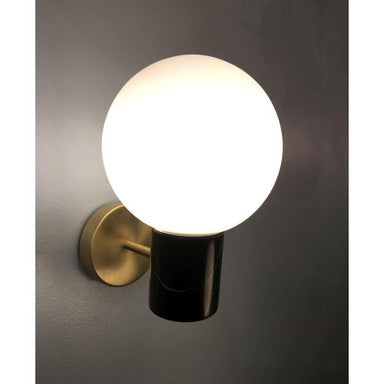 Maxim Lighting 26030SWSBRBK Vesper 1 Light Wall Sconce illuminated on gray wall showing satin brass and black marble detail