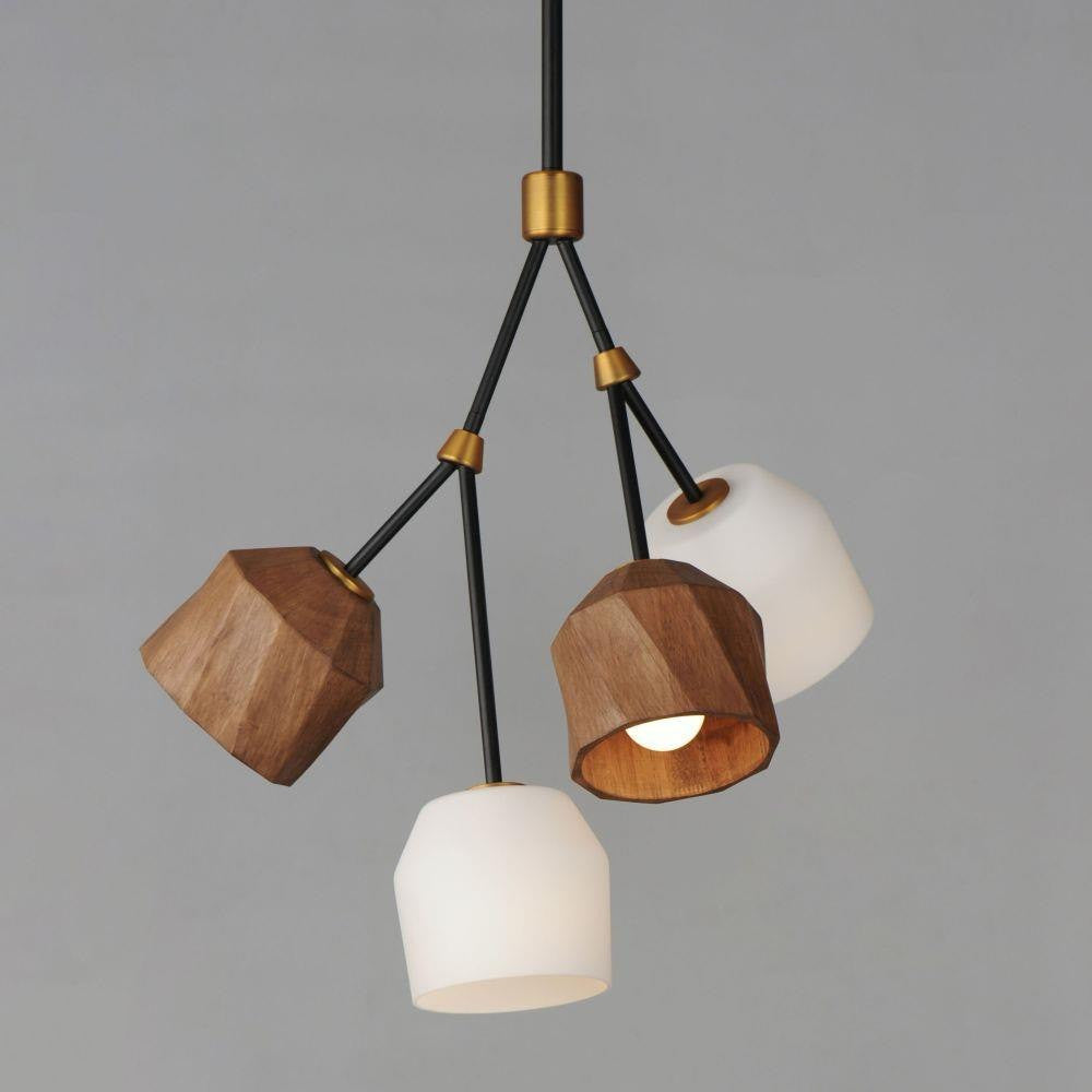 Close-up of Maxim Lighting 28274DBZAB Akimbo 4 Light Pendant showing illuminated walnut wood and frosted glass shades on grey background