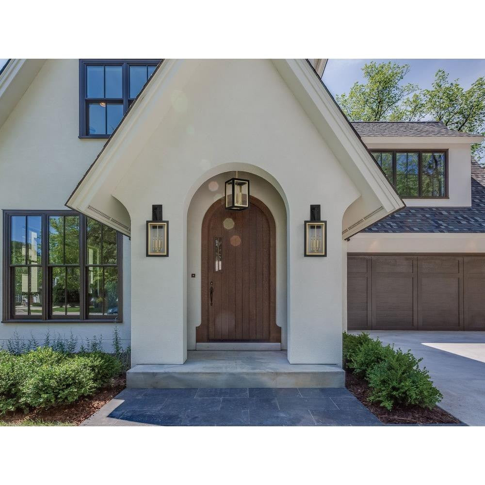 Maxim Lighting 30056CLBKGLD Neoclass Outdoor Wall Lantern shown on home entryway lifestyle photo