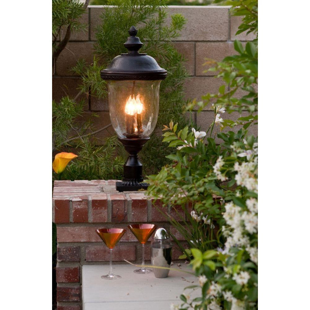 Maxim Lighting Carriage House DC collection Oriental Bronze outdoor lantern lifestyle shot in garden setting
