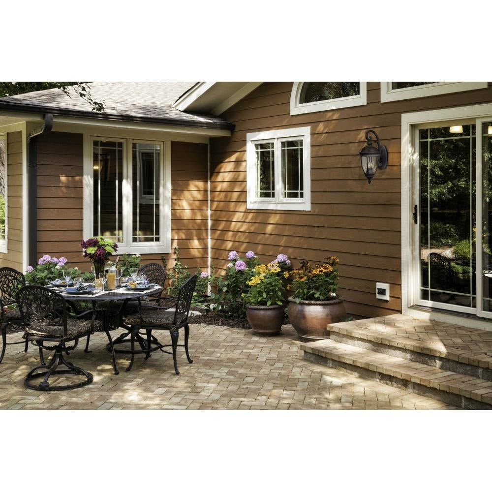 Maxim Lighting 3466CDSE Knob Hill DC Outdoor Wall Lantern shown in outdoor backyard setting