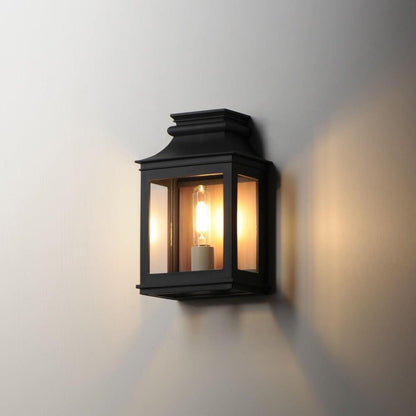 Maxim Lighting 40912CLACPBO Savannah Vx Outdoor Wall Lantern illuminated on wall - lifestyle view