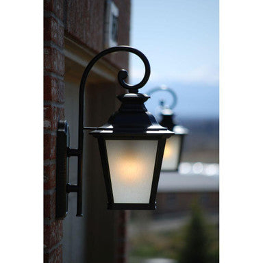Maxim Lighting 51125FSBZ Knoxville Outdoor Wall Lantern Installed on Brick Exterior - Dusk Lifestyle