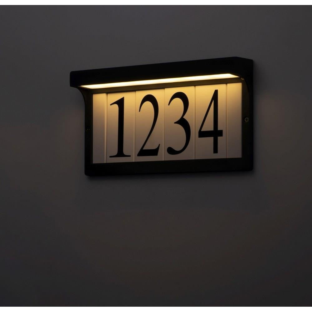 Maxim Lighting 53610BZ Address Light illuminated at night showing warm LED glow