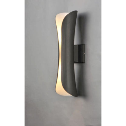 Maxim Lighting 86146ABZ Scroll LED Outdoor Wall Sconce illuminated on gray wall - side angle view