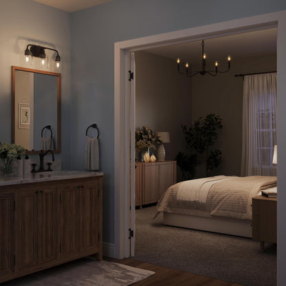 Progress Lighting P400462-31M Ilia Matte Black Chandelier nighttime lifestyle in bedroom and bathroom setting