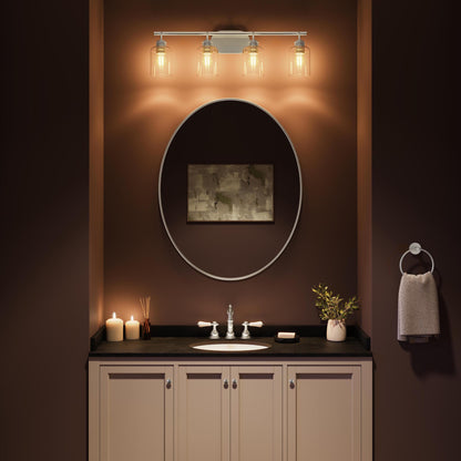 Progress Lighting P300568-009 Reines 4 Light Brushed Nickel Bath Vanity installed above bathroom mirror - nighttime lifestyle shot