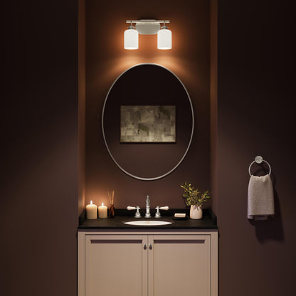 Progress Lighting P300578-009 Reines Bath Vanity Light installed above bathroom mirror - night view