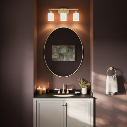 Progress Lighting Reines P300579-191 Brushed Gold 3 Light Bath Vanity installed above bathroom mirror - Day Scene