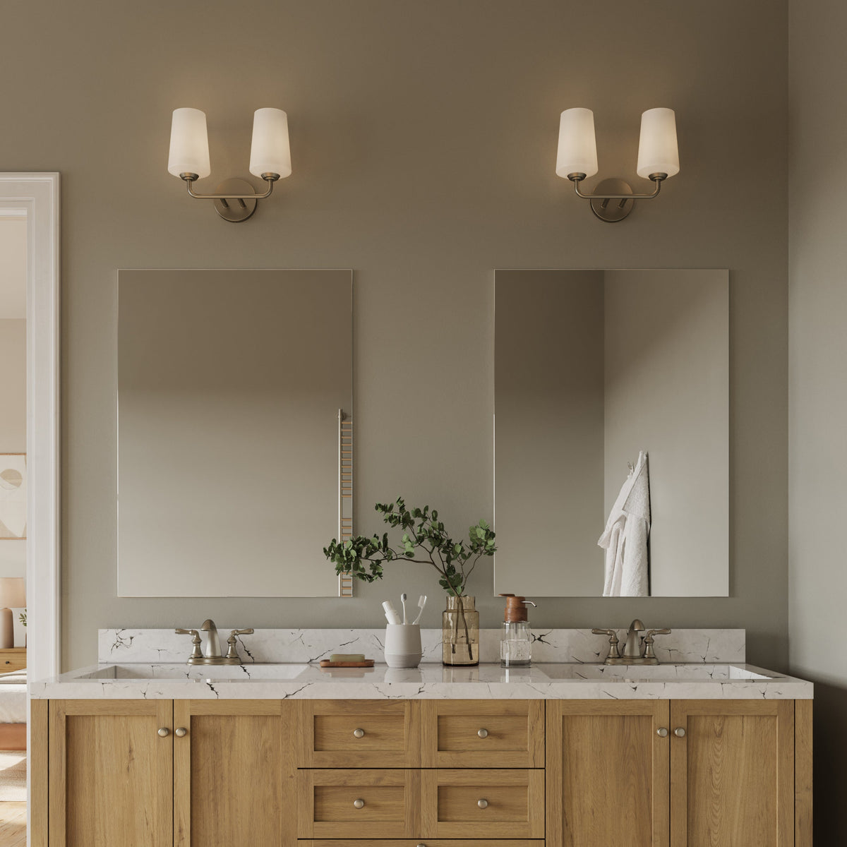 Progress Lighting Celino brushed nickel bath vanity wall light in bathroom setting