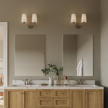 Progress Lighting Celino brushed nickel bath vanity wall light in bathroom setting