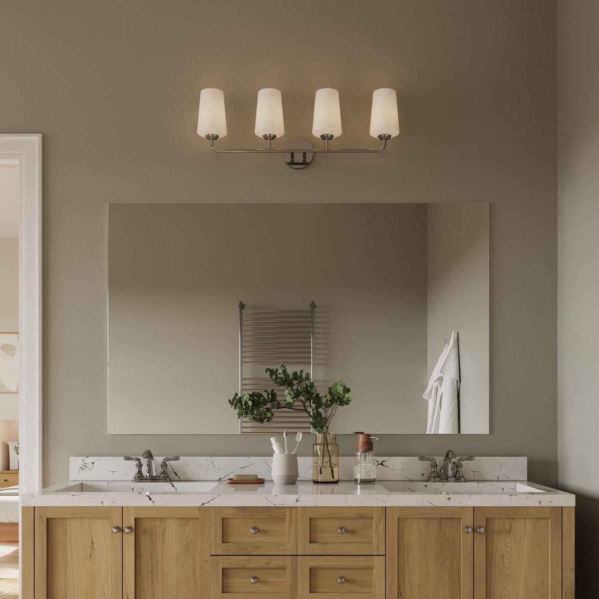 Progress Lighting Celino 4 light bath vanity wall light installed above bathroom mirror