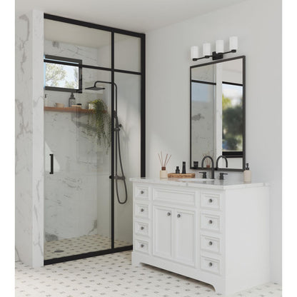 Progress Lighting Estrada 4 light matte black bath vanity wall light installed above bathroom mirror