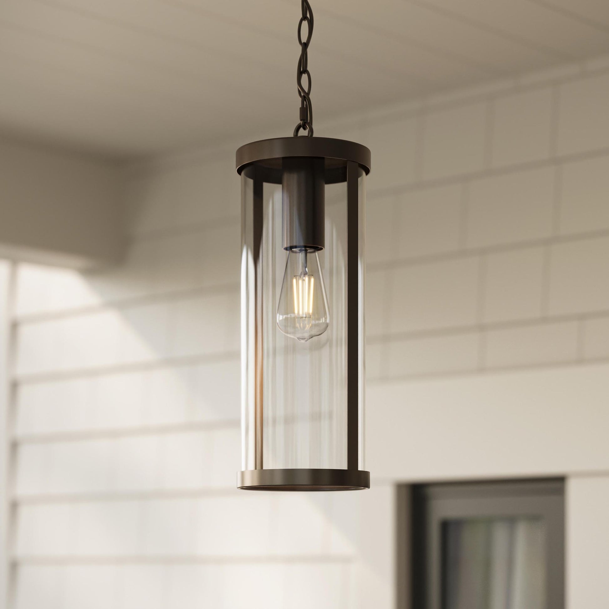 Progress Lighting P550145-020 Kagen Antique Bronze Outdoor Pendant Hanging Lantern installed on covered porch ceiling