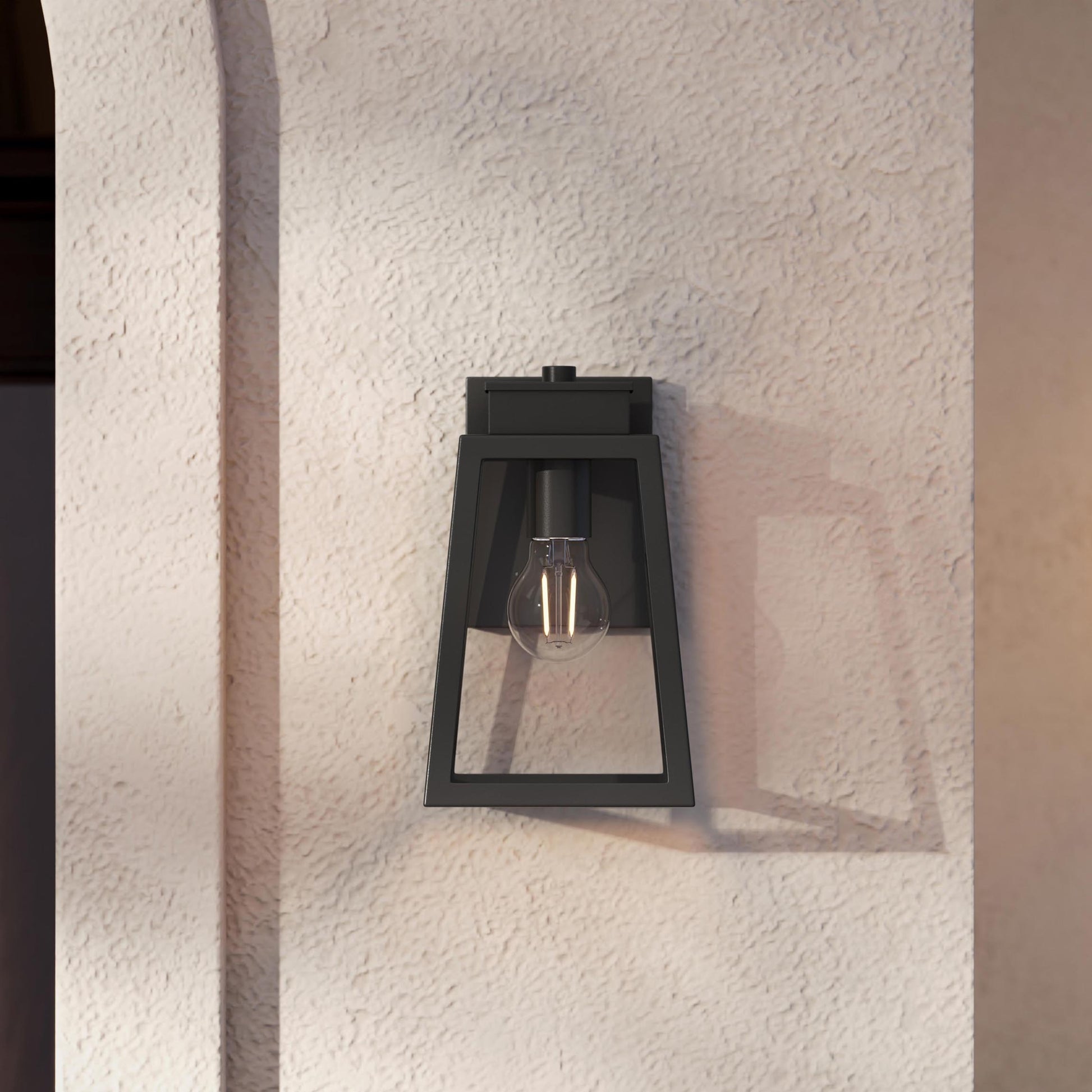 Progress Lighting P560401-31M Hedry Matte Black Outdoor Wall Lantern - Close-Up Detail View on Textured Stucco Wall