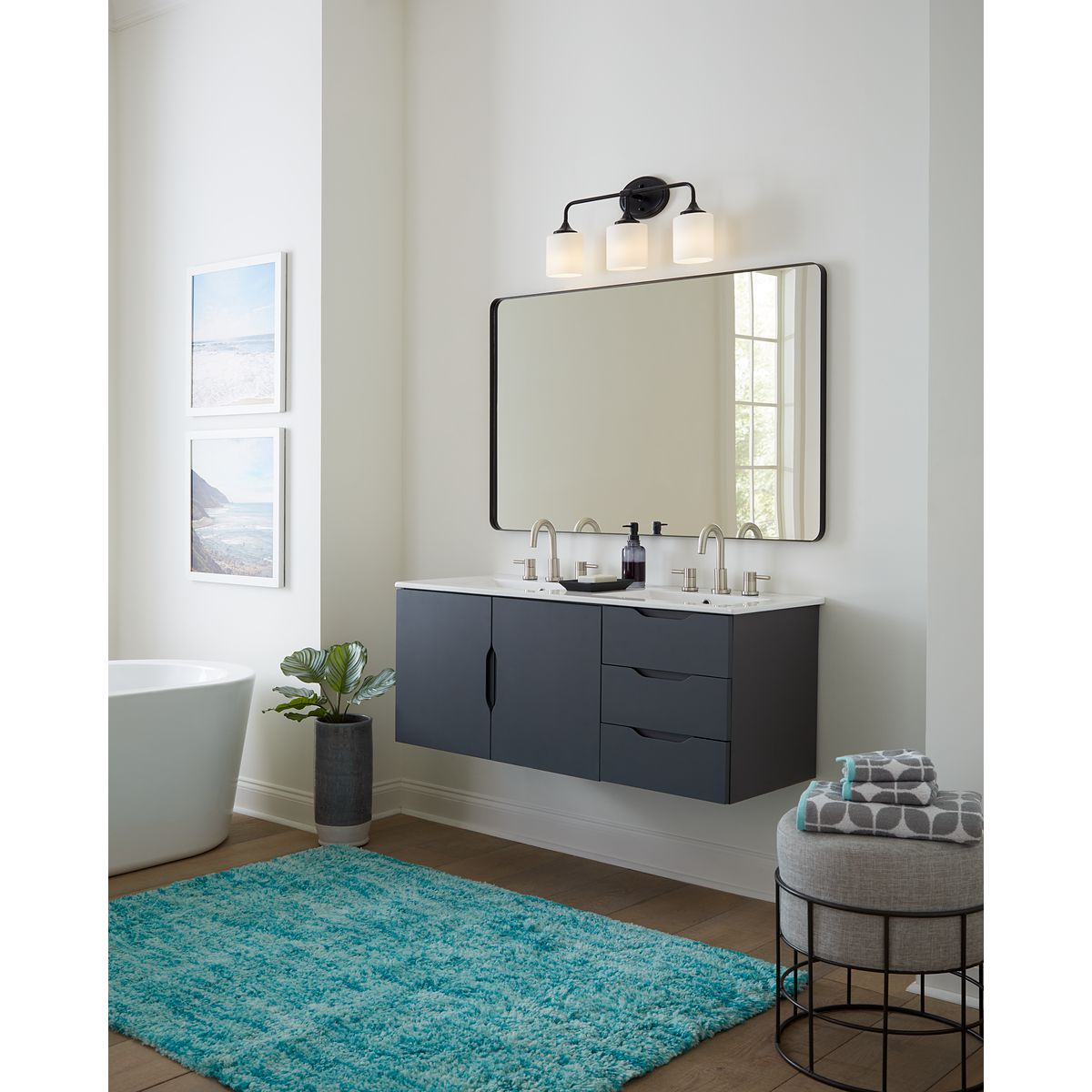 Progress Lighting Lynzie matte black 3 light bath vanity wall light in bathroom setting
