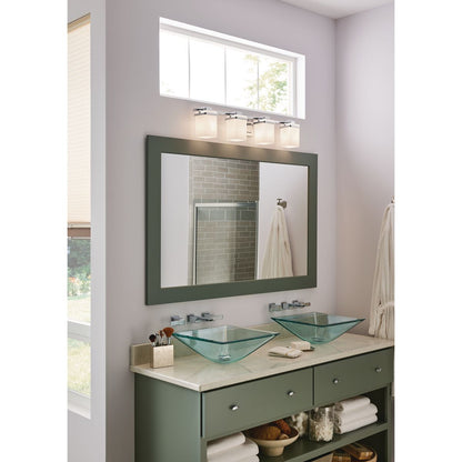 Progress Lighting Metric 4 light bath vanity wall light installed above bathroom mirror