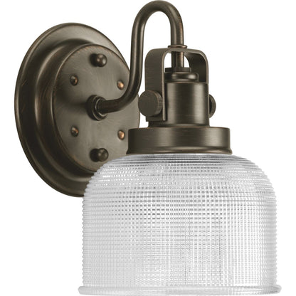 Progress Lighting Archie 1 light Venetian Bronze bath vanity wall light with clear prismatic glass shade