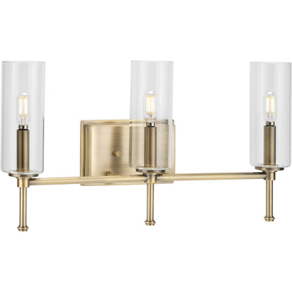 Progress Lighting P300358-163 Elara 3-Light Vintage Brass Bath Vanity Wall Light with Clear Glass Cylindrical Shades