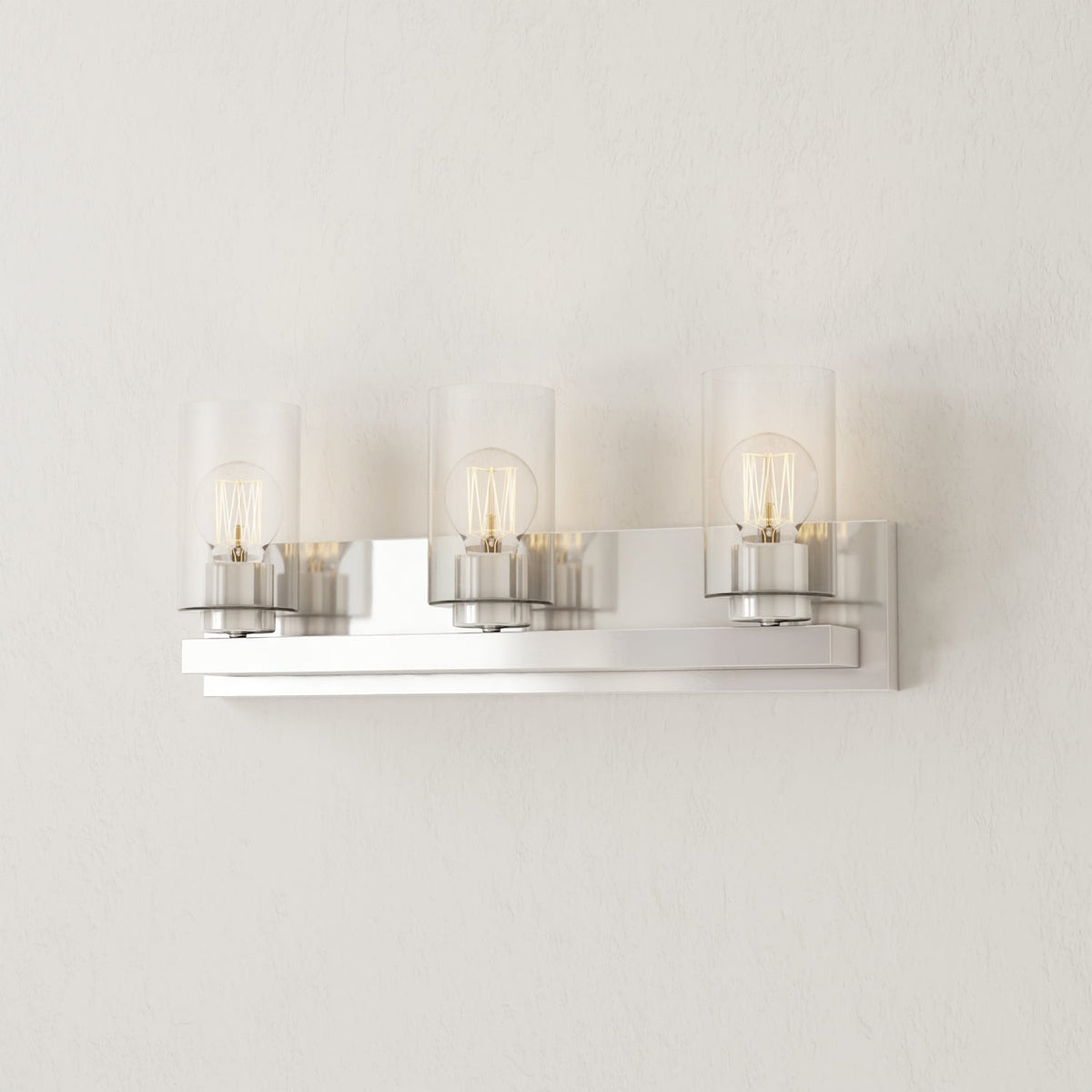 Progress Lighting Goodwin 3 light brushed nickel vanity light illuminated