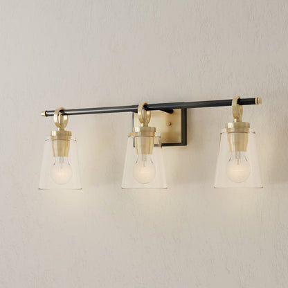 Progress Lighting Cassell 3 light bath vanity wall light illuminated in Vintage Brass