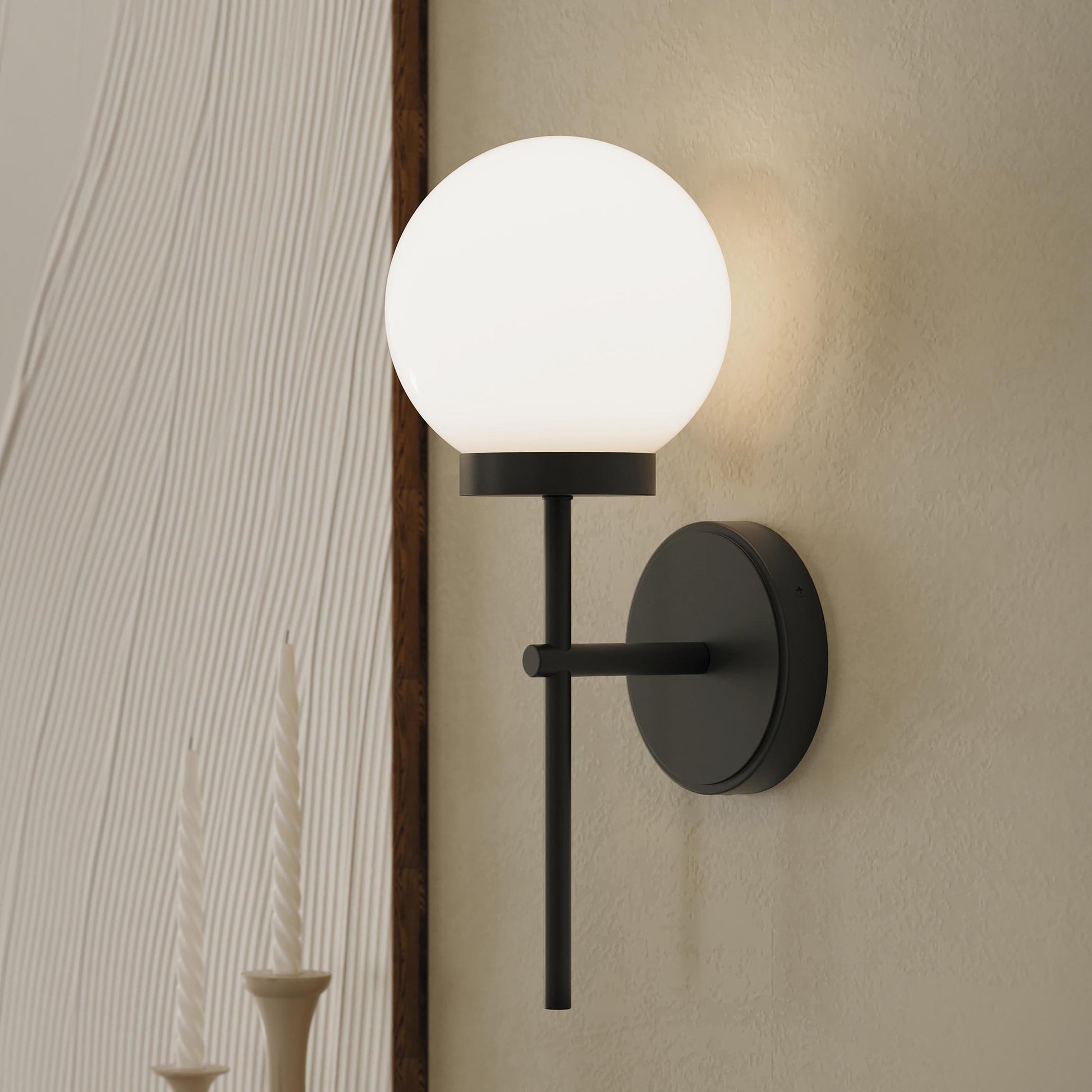 Progress Lighting P710157-31M Rigsby Matte Black Wall Sconce installed in a living room setting