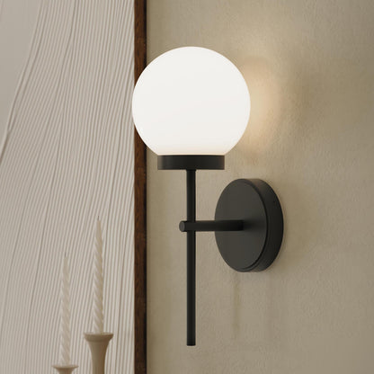Progress Lighting P710157-31M Rigsby Matte Black Wall Sconce installed in a living room setting