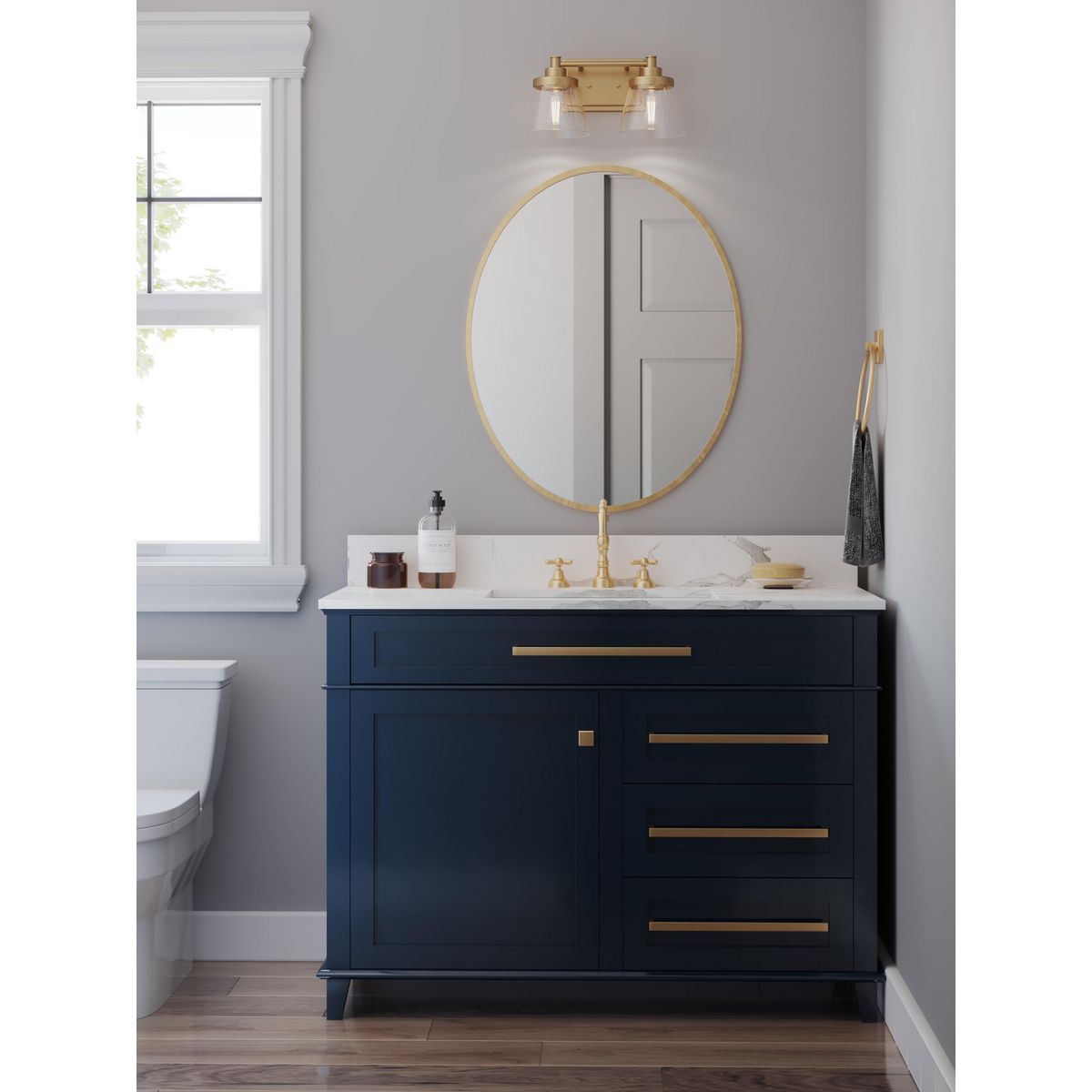 Progress Lighting Hinton vintage brass 2 light bath vanity wall light in bathroom setting