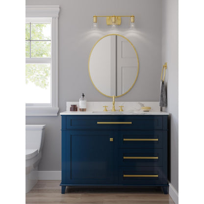 Progress Lighting Adley 3 light satin brass bath vanity wall light installed above bathroom mirror