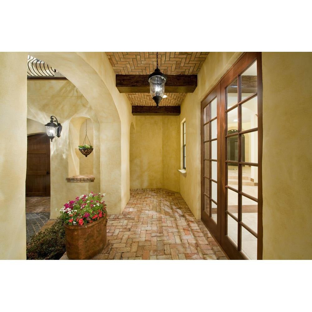 Maxim Lighting Carriage House VX Outdoor Wall Lantern lifestyle shot in covered outdoor entryway hallway