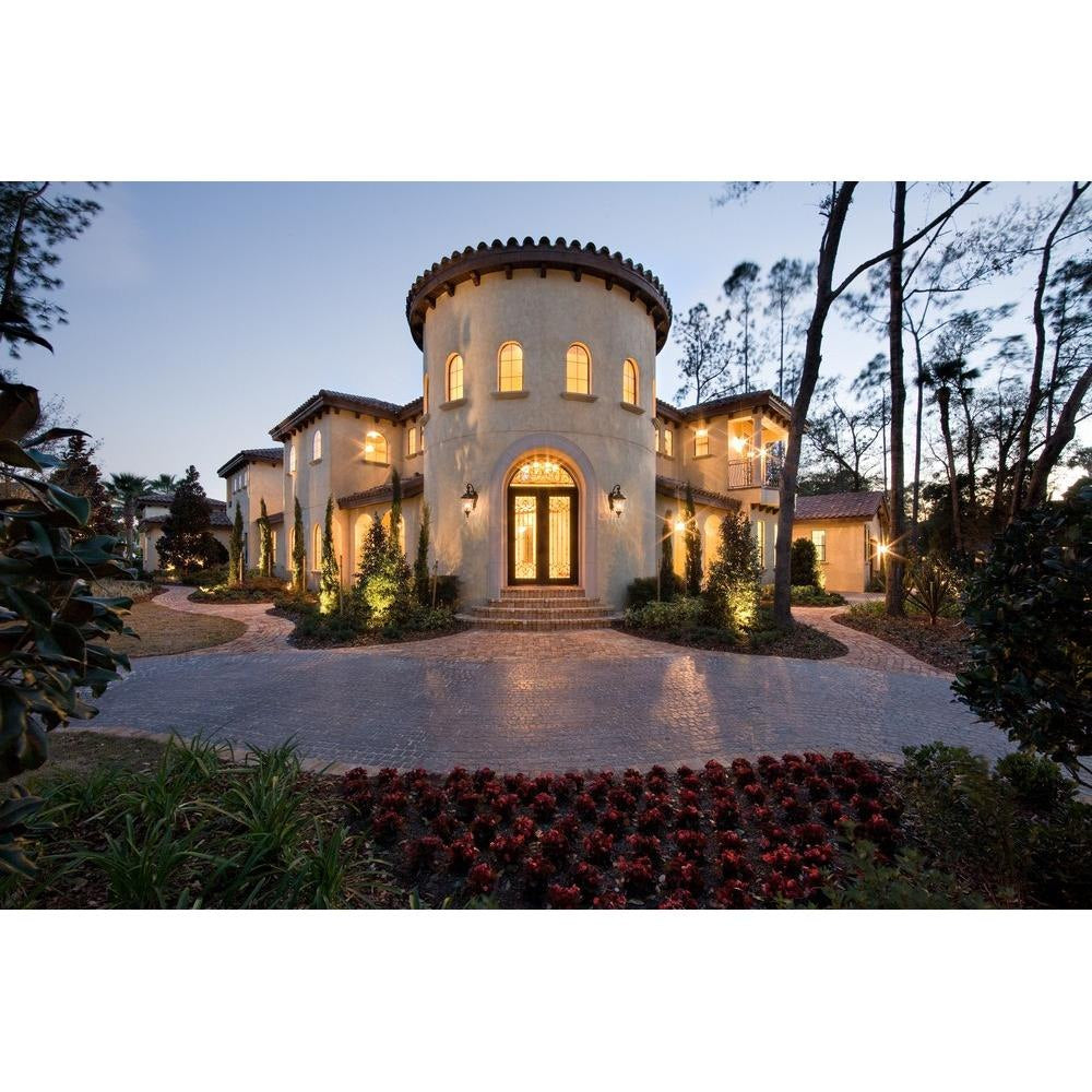 Maxim Lighting Carriage House VX Outdoor Wall Lanterns installed on luxury home exterior at dusk