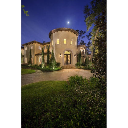 Carriage House VX collection lifestyle photo - Mediterranean estate exterior illuminated at night