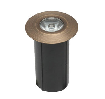 ABBA Lighting USA DMB52 Step Light, cast brass finish, cylindrical shape with clear top, designed for outdoor landscape use.